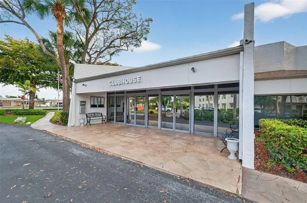 a view of a patio with dining table and chairs