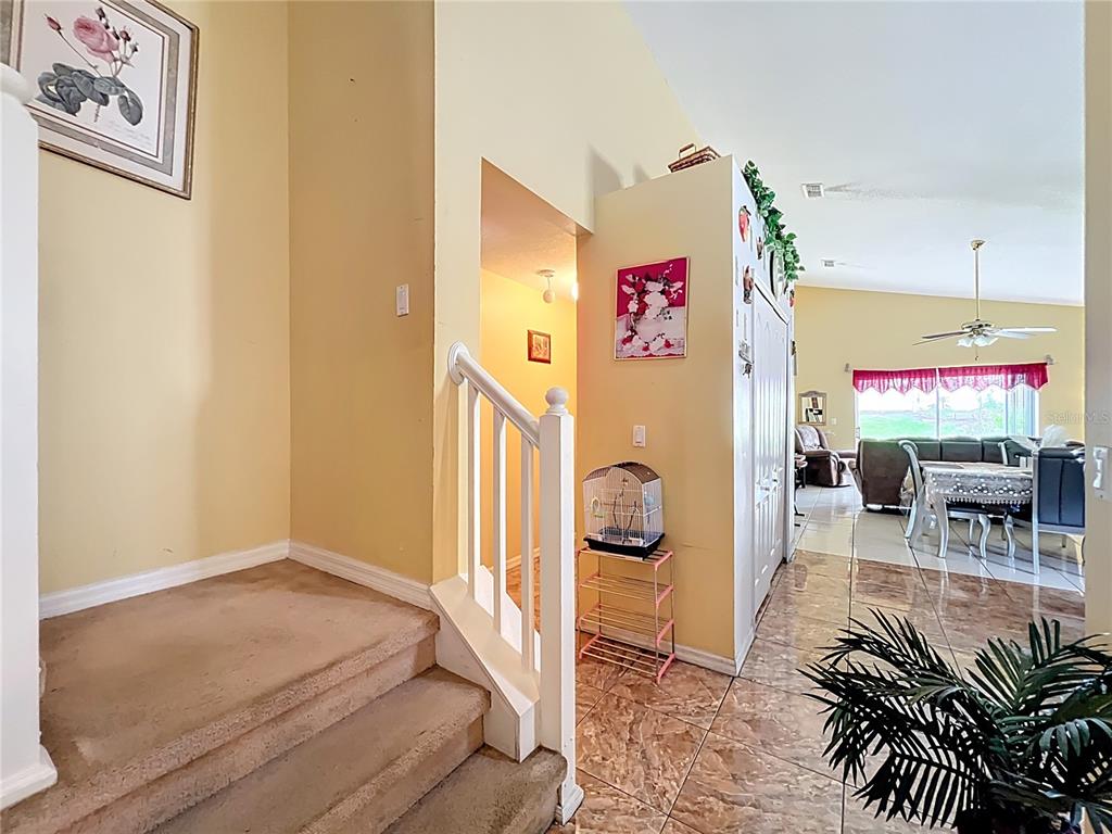 7939 Riffle Lane Orlando, FL 32818 - Photo 20 of 52 a living room with furniture and a table