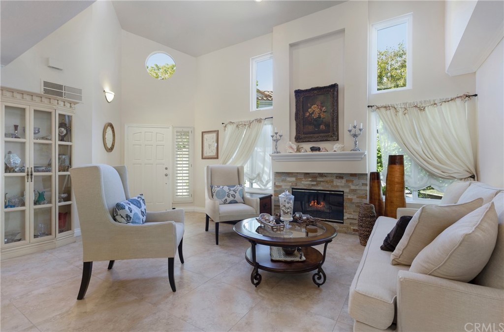 20 Stream Street Laguna Niguel, CA 92677 - Photo 1 of 28 a living room with furniture and a fireplace