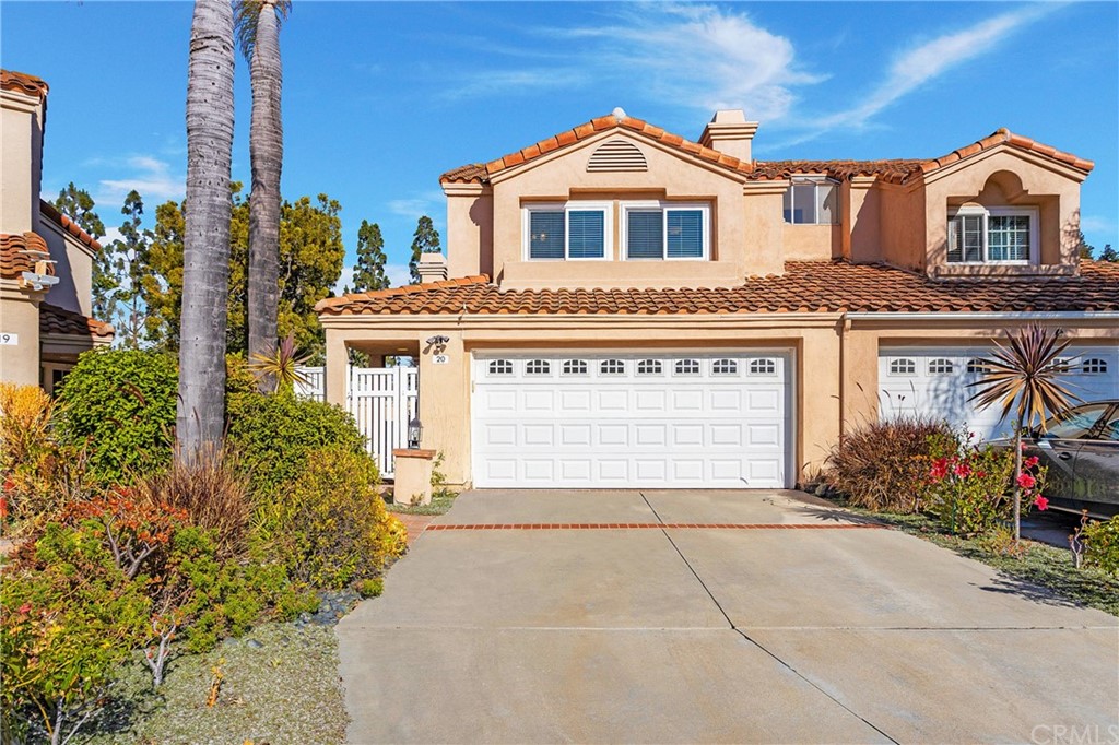 20 Stream Street Laguna Niguel, CA 92677 - Photo 26 of 28 a front view of a house with a yard and garage