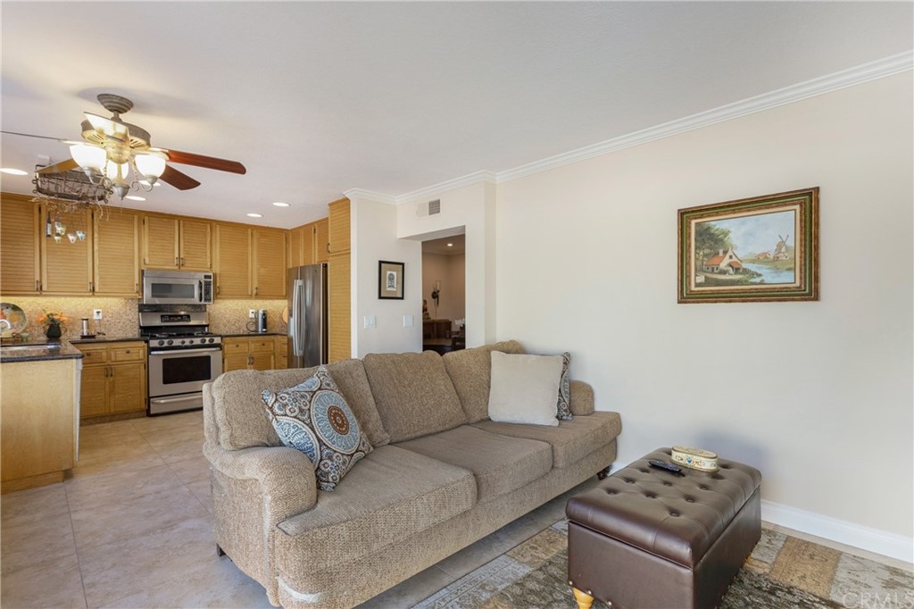 20 Stream Street Laguna Niguel, CA 92677 - Photo 7 of 28 a living room with furniture kitchen and a chandelier