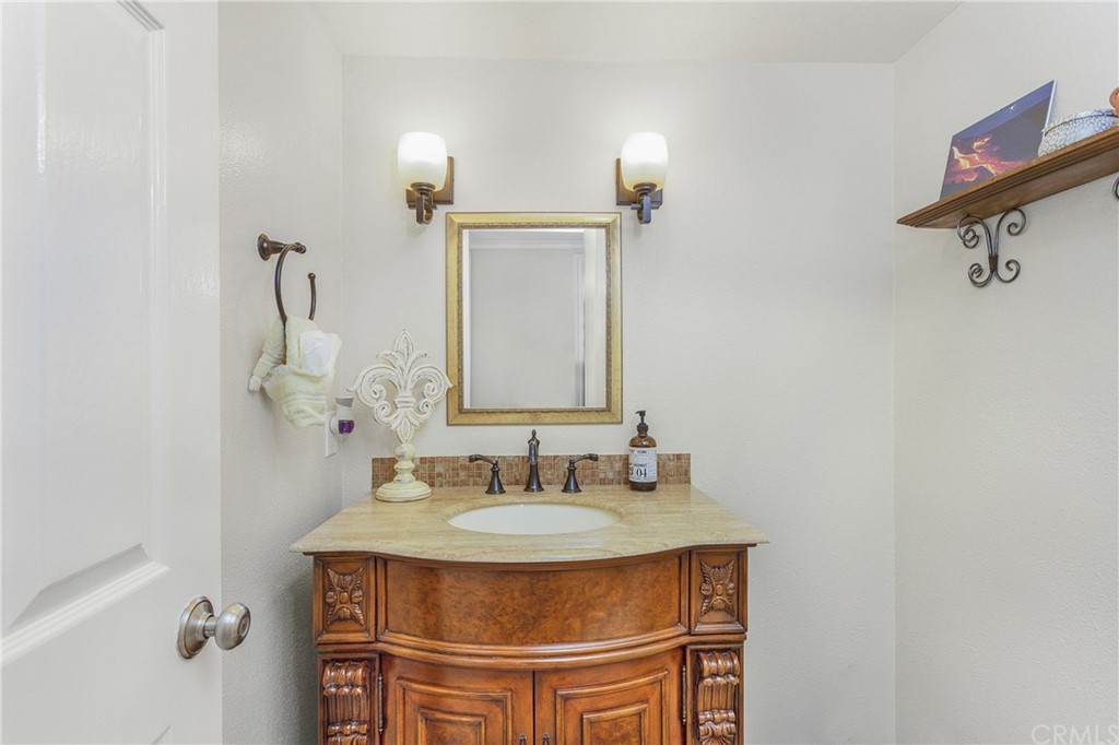 20 Stream Street Laguna Niguel, CA 92677 - Photo 10 of 28 a bathroom with a sink and a mirror