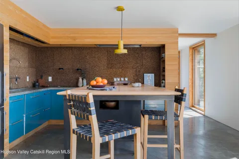 a kitchen with a table and chairs