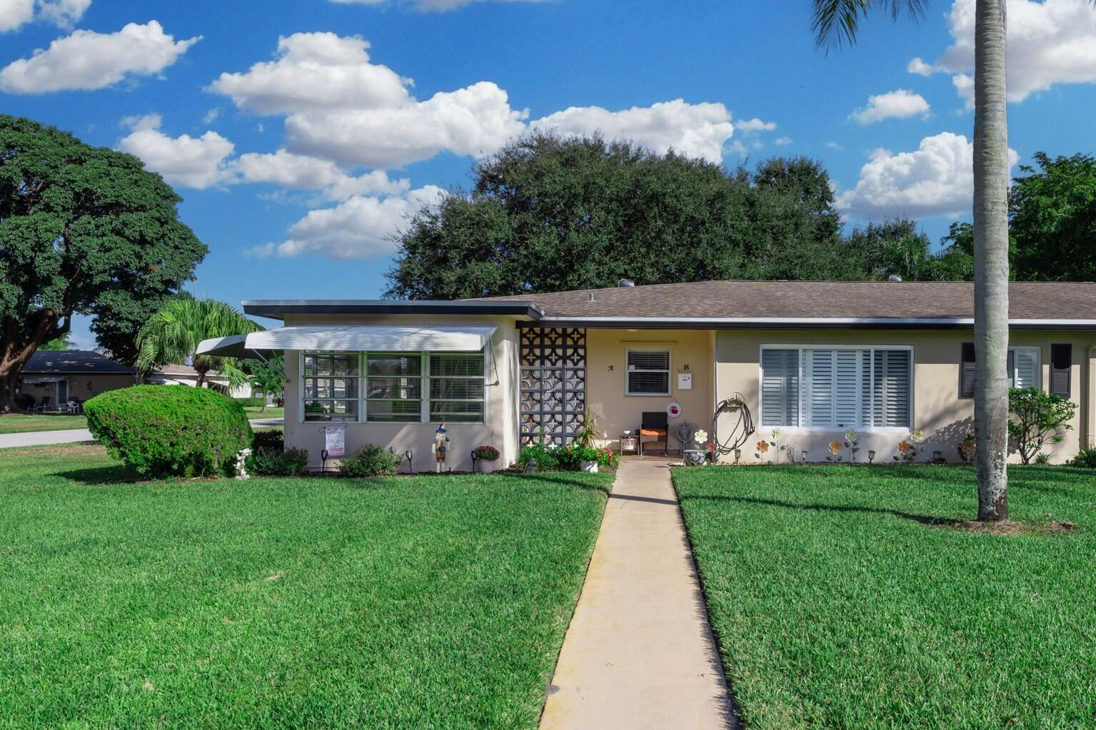 front view of a house with a yard
