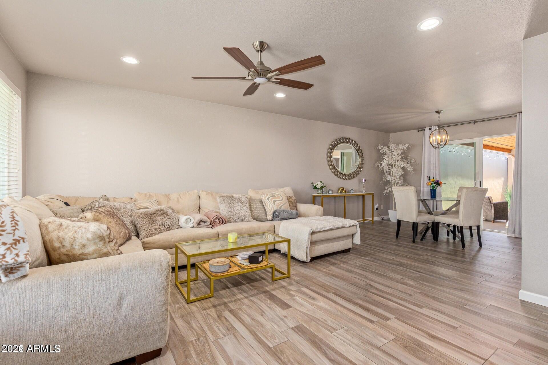 5913 East Thomas Road Scottsdale, AZ 85251 - Photo 11 of 26 a living room with furniture a clock on wall and a window