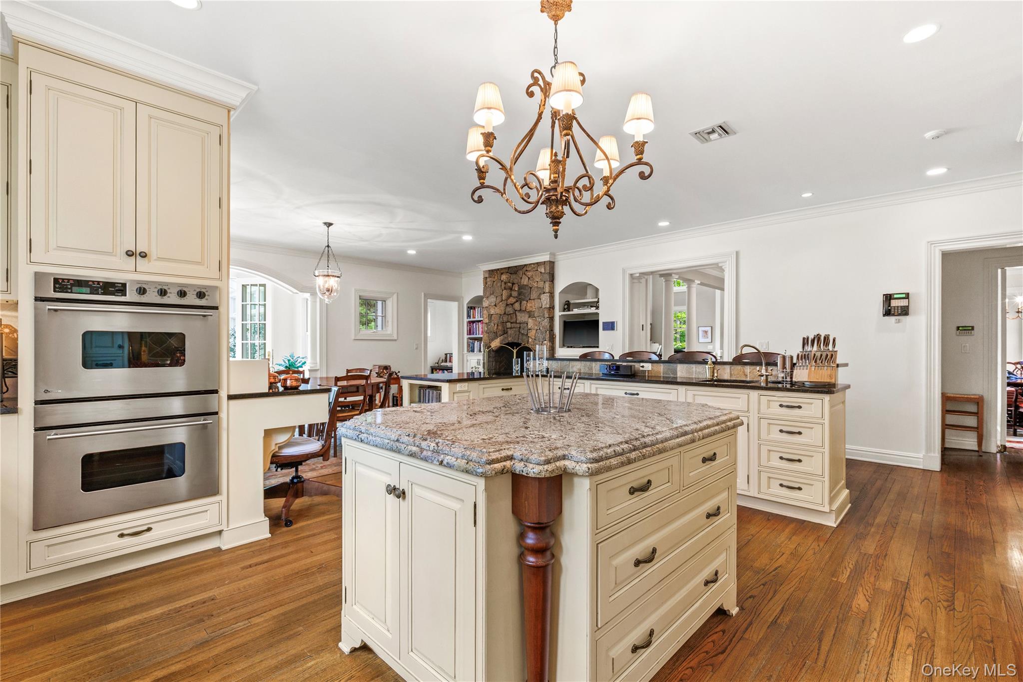 63 Old Mill River Road Pound Ridge, NY 10576 - Photo 8 of 47 a kitchen with stainless steel appliances granite countertop a white cabinets and stove top oven