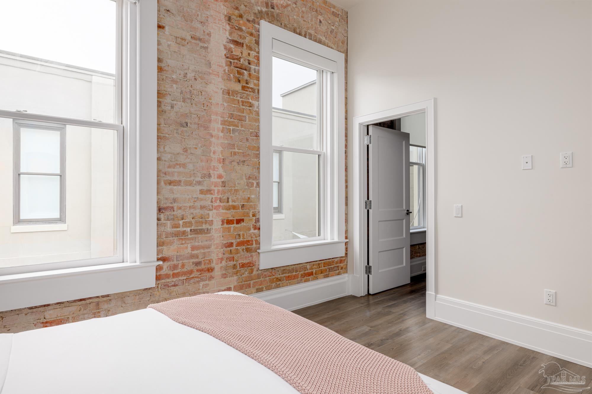 17 Palafox Place, Unit 307 Pensacola, FL 32502 - Photo 12 of 27 an empty room with windows and closet