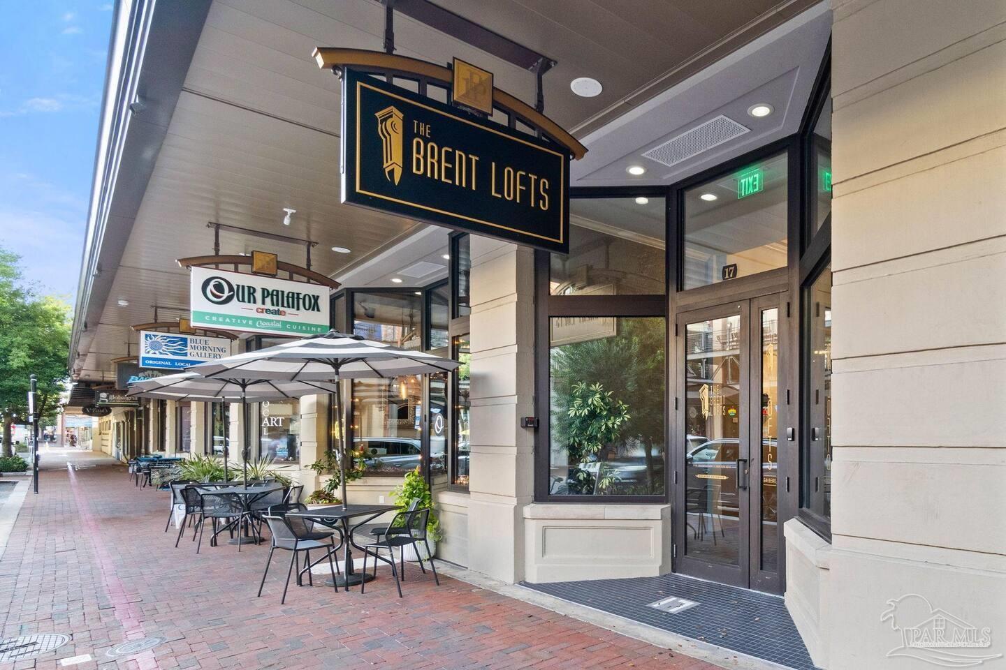 17 Palafox Place, Unit 307 Pensacola, FL 32502 - Photo 3 of 27 a view of a chairs and table in a patio