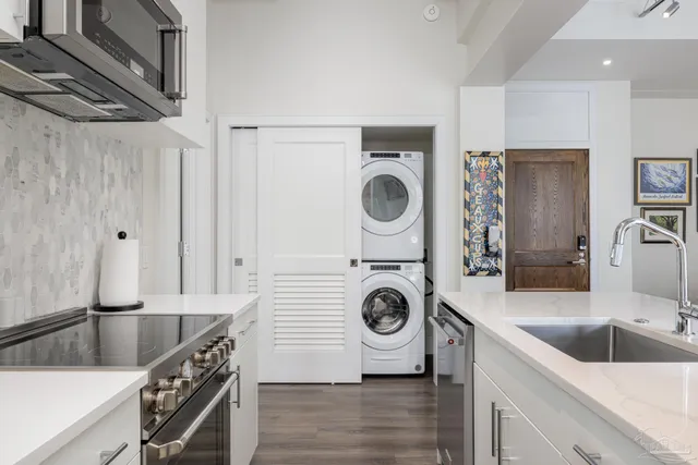 a kitchen with a stove sink and a refrigerator