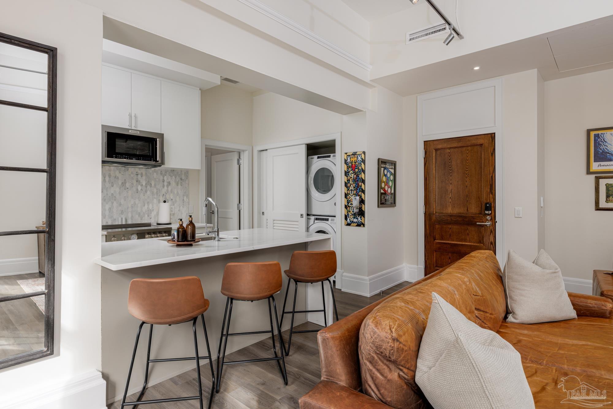 17 Palafox Place, Unit 307 Pensacola, FL 32502 - Photo 8 of 27 a bedroom with furniture and a bathroom