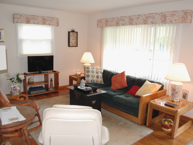 686 Walnut Road Wauconda, IL 60084 - Photo 3 of 21 a living room with furniture a flat screen tv and a window