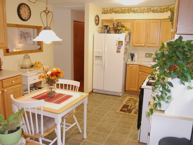 686 Walnut Road Wauconda, IL 60084 - Photo 7 of 21 a dining room with furniture and a chandelier