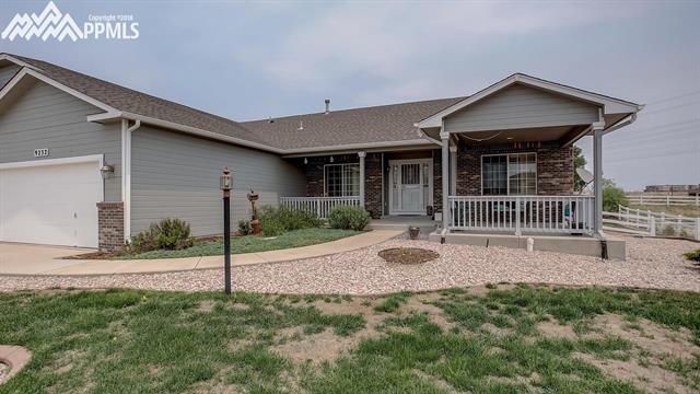 9232 Rockingham Drive Peyton, CO 80831 - Photo 3 of 35 Front with covered porch area and drop down screens if needed.