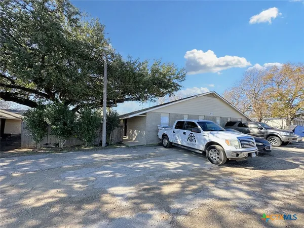 a car parked in front of a house