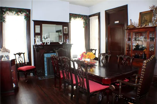 a view of a dining room with furniture and chandelier