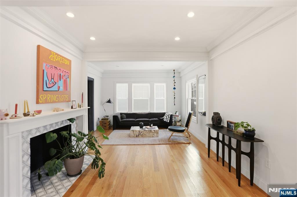 403 Lawn Ridge Road Orange, NJ 07050 - Photo 11 of 45 a living room with furniture fireplace and flat screen tv