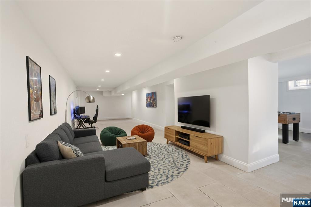 403 Lawn Ridge Road Orange, NJ 07050 - Photo 19 of 45 a living room with furniture and a flat screen tv