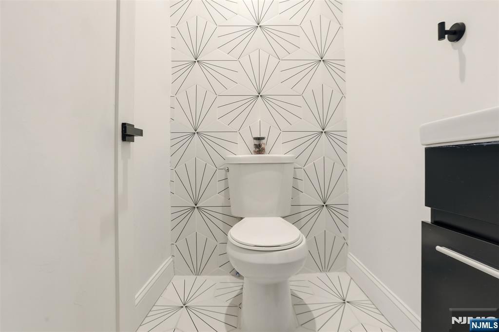 403 Lawn Ridge Road Orange, NJ 07050 - Photo 22 of 45 a bathroom with a toilet and a sink