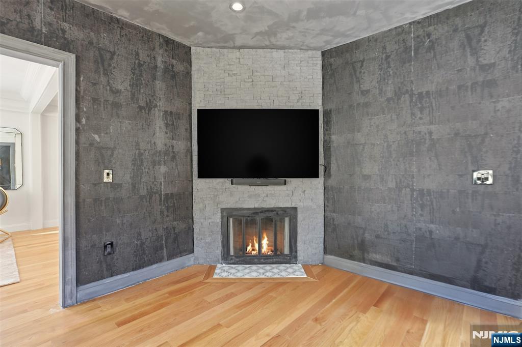 403 Lawn Ridge Road Orange, NJ 07050 - Photo 23 of 45 a view of an empty room with a fireplace and a window
