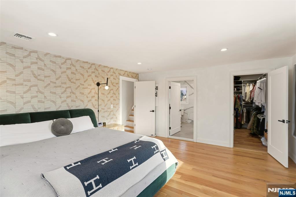 403 Lawn Ridge Road Orange, NJ 07050 - Photo 27 of 45 a bedroom with a bed and a large mirror