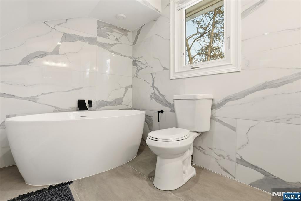 403 Lawn Ridge Road Orange, NJ 07050 - Photo 31 of 45 a white toilet sitting next to a white sink