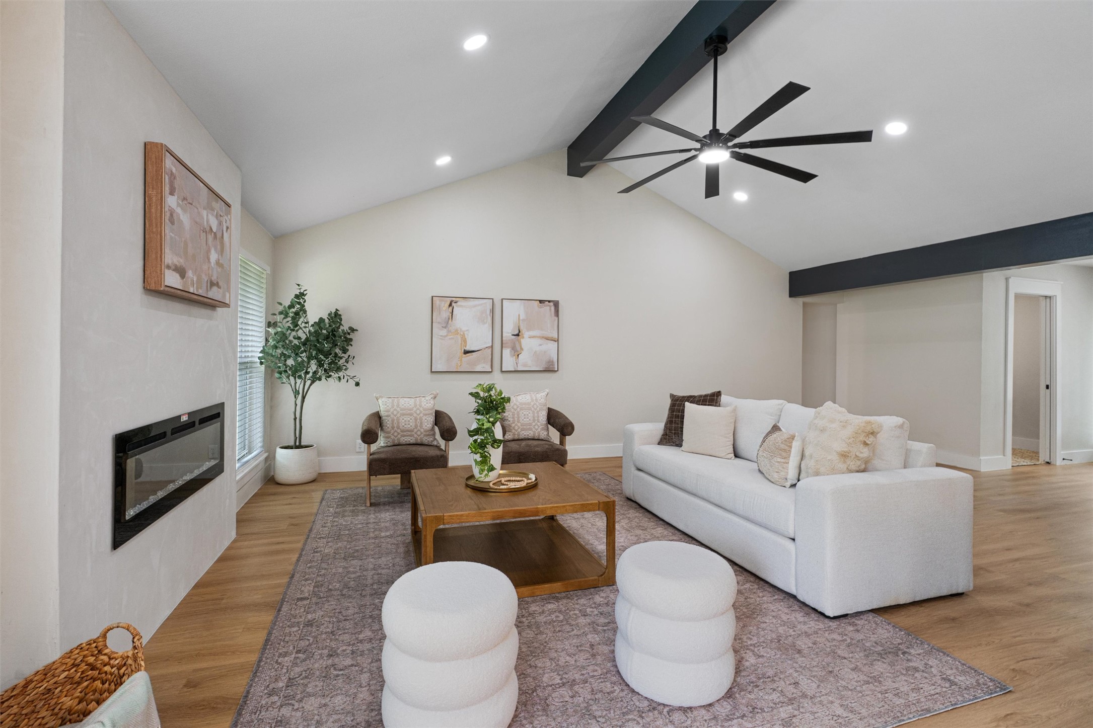 224 Clear Spring Road Georgetown, TX 78628 - Photo 12 of 40 a living room with furniture a fireplace and a ceiling fan