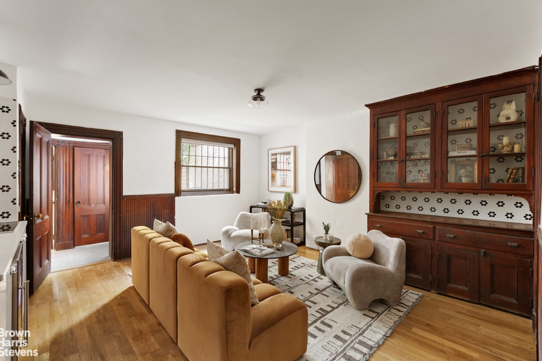 1456 Dean Street Brooklyn, NY 11213 - Photo 11 of 28 a living room with furniture a lamp and a large window