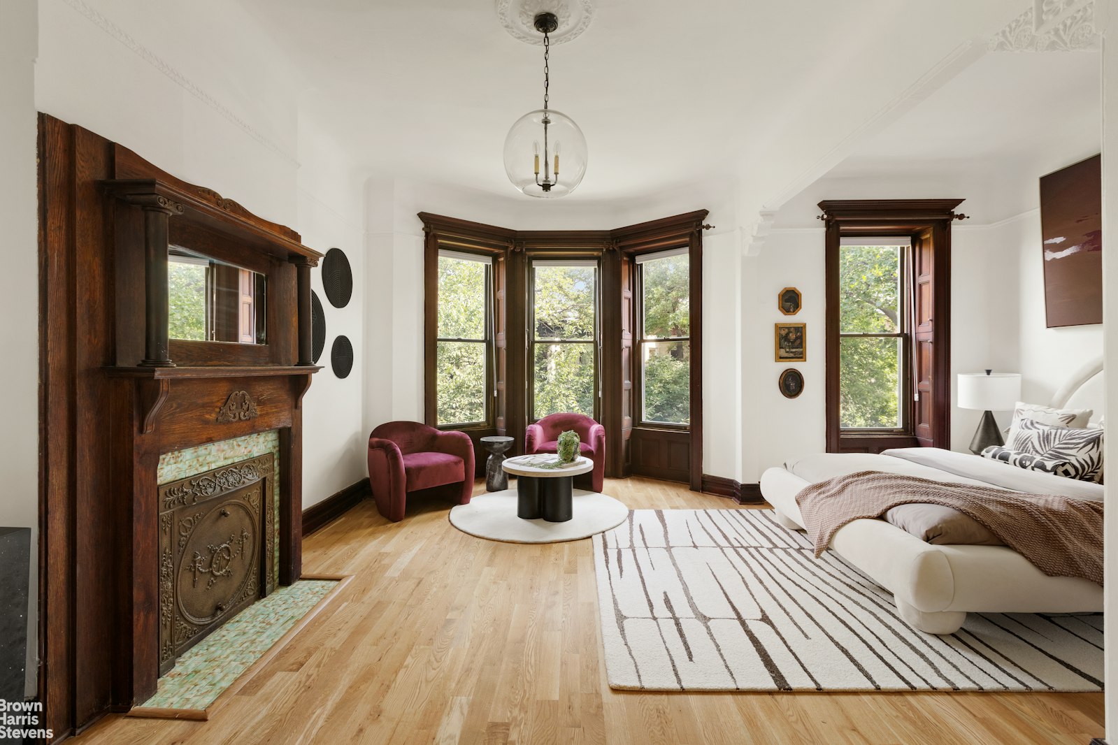 1456 Dean Street Brooklyn, NY 11213 - Photo 21 of 28 a bedroom with furniture a fireplace and windows