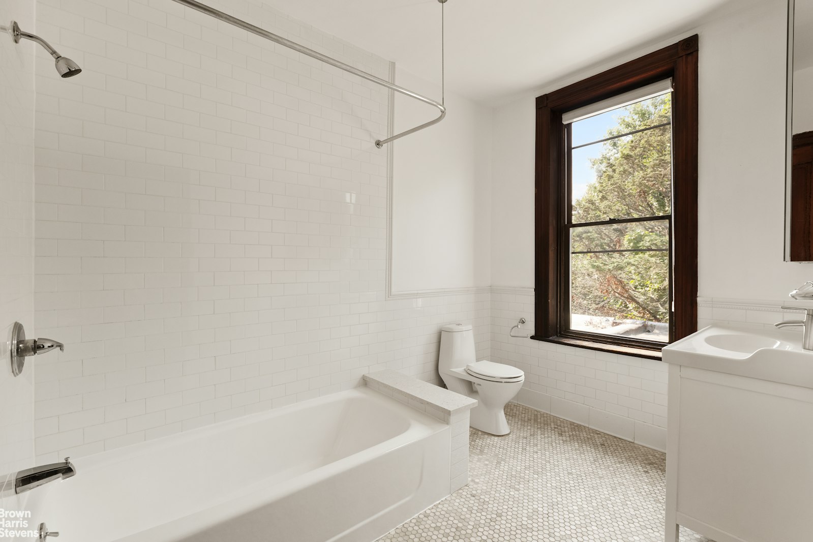 1456 Dean Street Brooklyn, NY 11213 - Photo 23 of 28 a bathroom with a bathtub a window and a shower