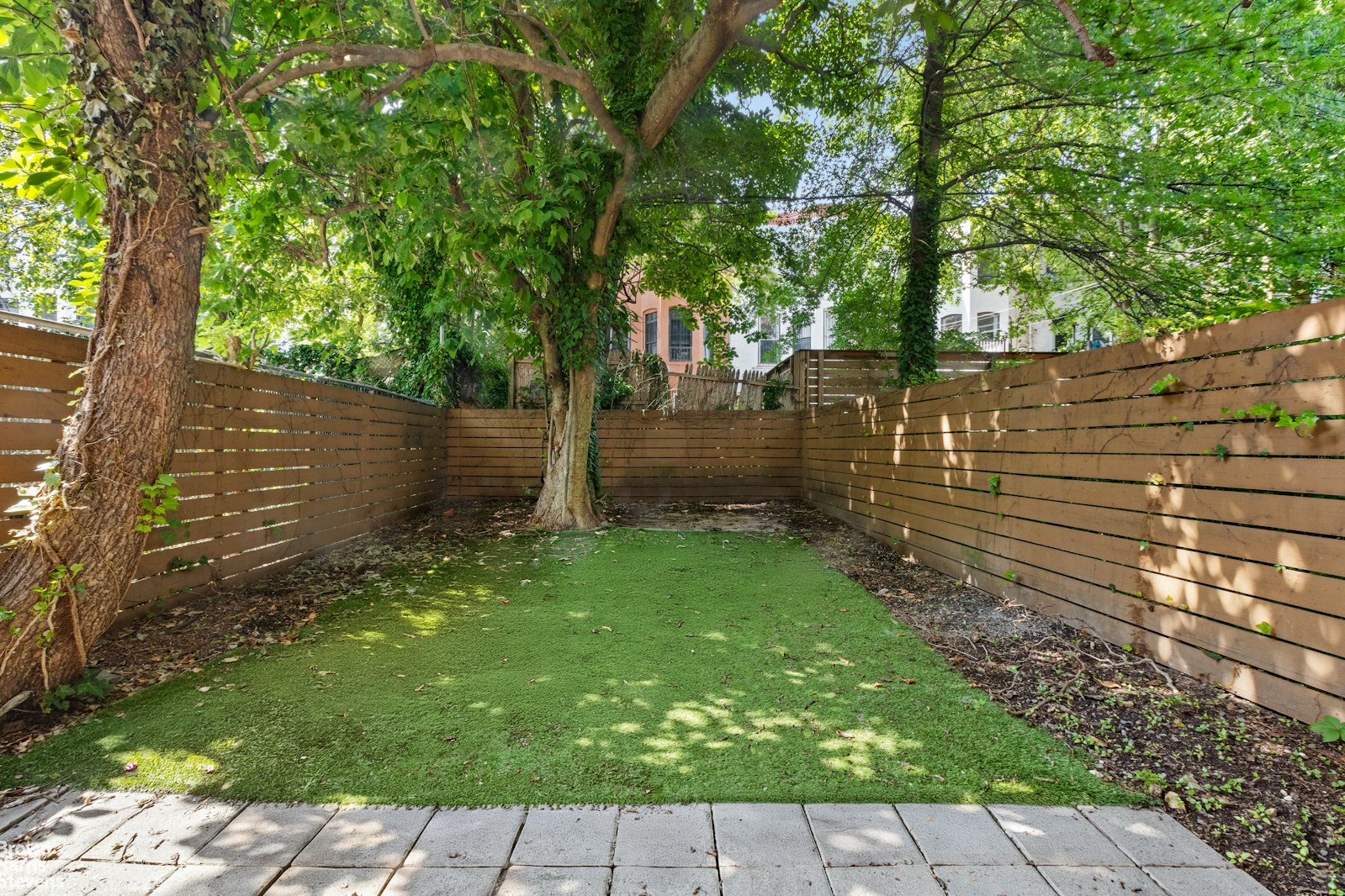 1456 Dean Street Brooklyn, NY 11213 - Photo 26 of 28 a backyard of a house with lots of green space