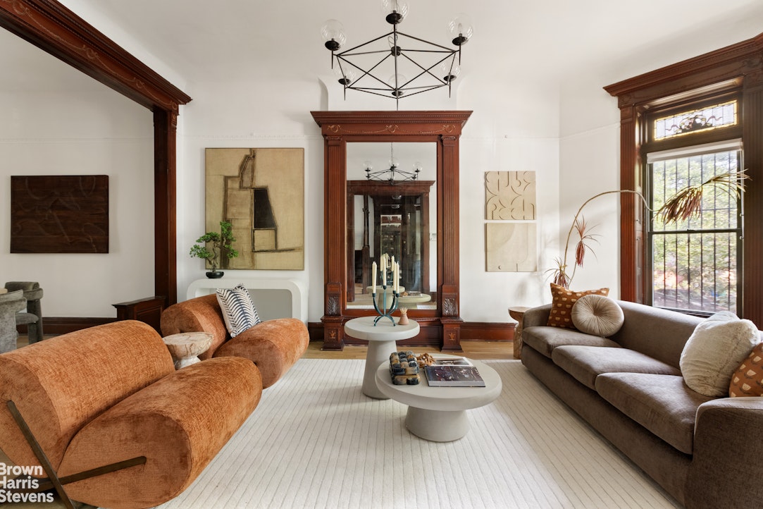 1456 Dean Street Brooklyn, NY 11213 - Photo 2 of 28 a living room with furniture and a large window