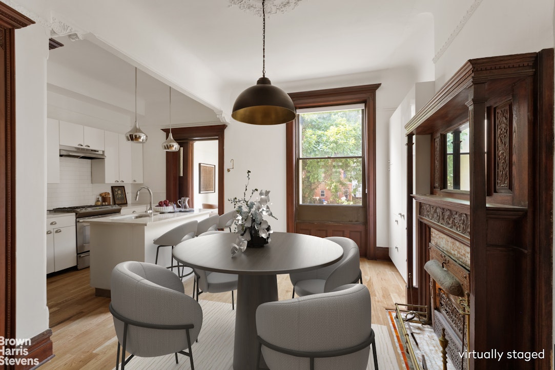 1456 Dean Street Brooklyn, NY 11213 - Photo 4 of 28 a dining room with furniture a chandelier and wooden floor