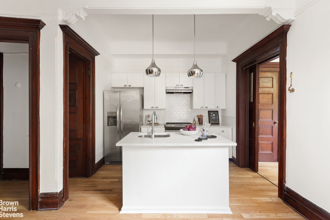 1456 Dean Street Brooklyn, NY 11213 - Photo 5 of 28 a room with stainless steel appliances kitchen island a sink a stove and cabinets