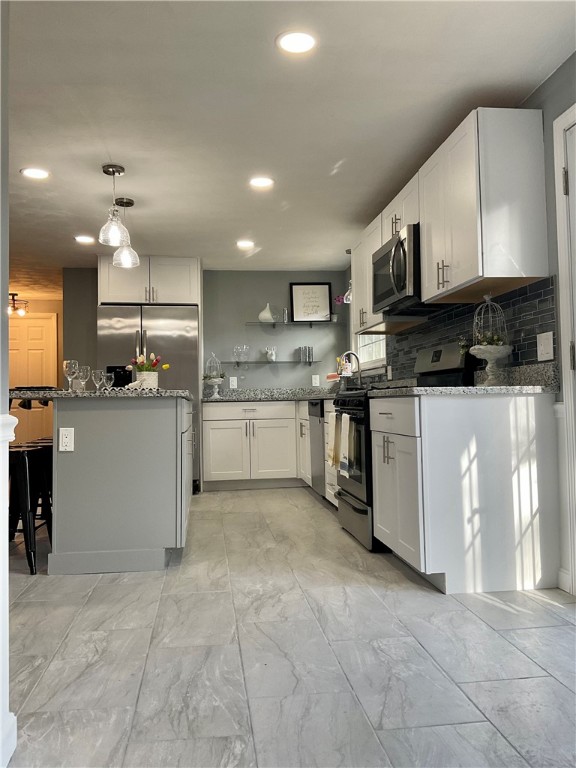 21 Continental Road Smithfield, RI 02828 - Photo 14 of 25 White kitchen cabinets surround