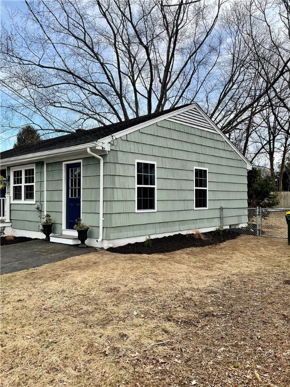 21 Continental Road Smithfield, RI 02828 - Photo 5 of 25 Landscaped side yard and second entrance