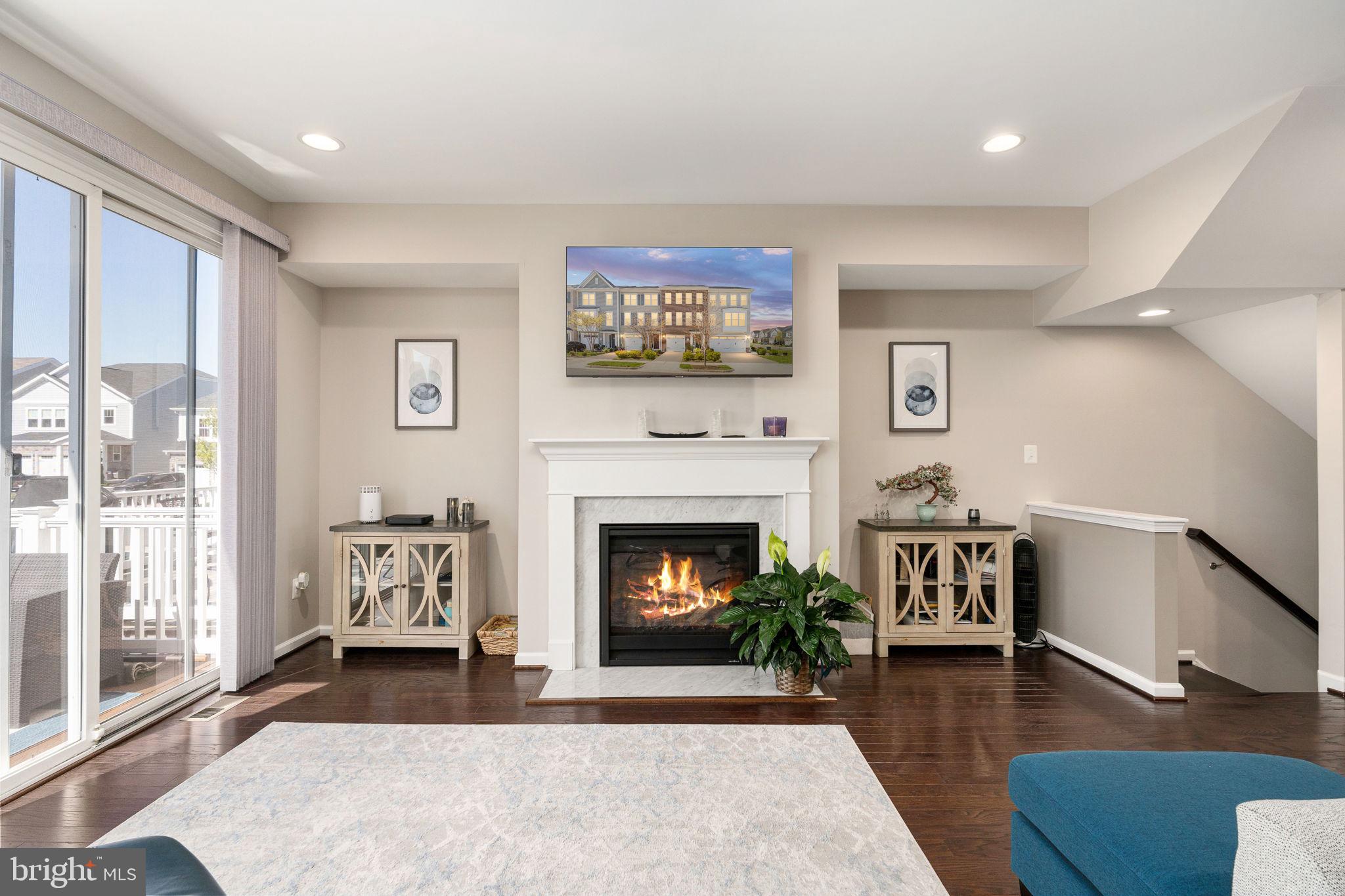 650 Aspen Road, Unit 108 Stafford, VA 22554 - Photo 14 of 30 a living room with furniture and a fireplace