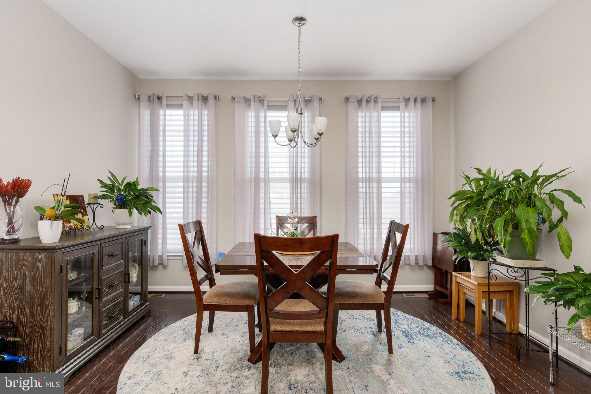 650 Aspen Road, Unit 108 Stafford, VA 22554 - Photo 18 of 30 a view of a dining room with furniture window and wooden floor