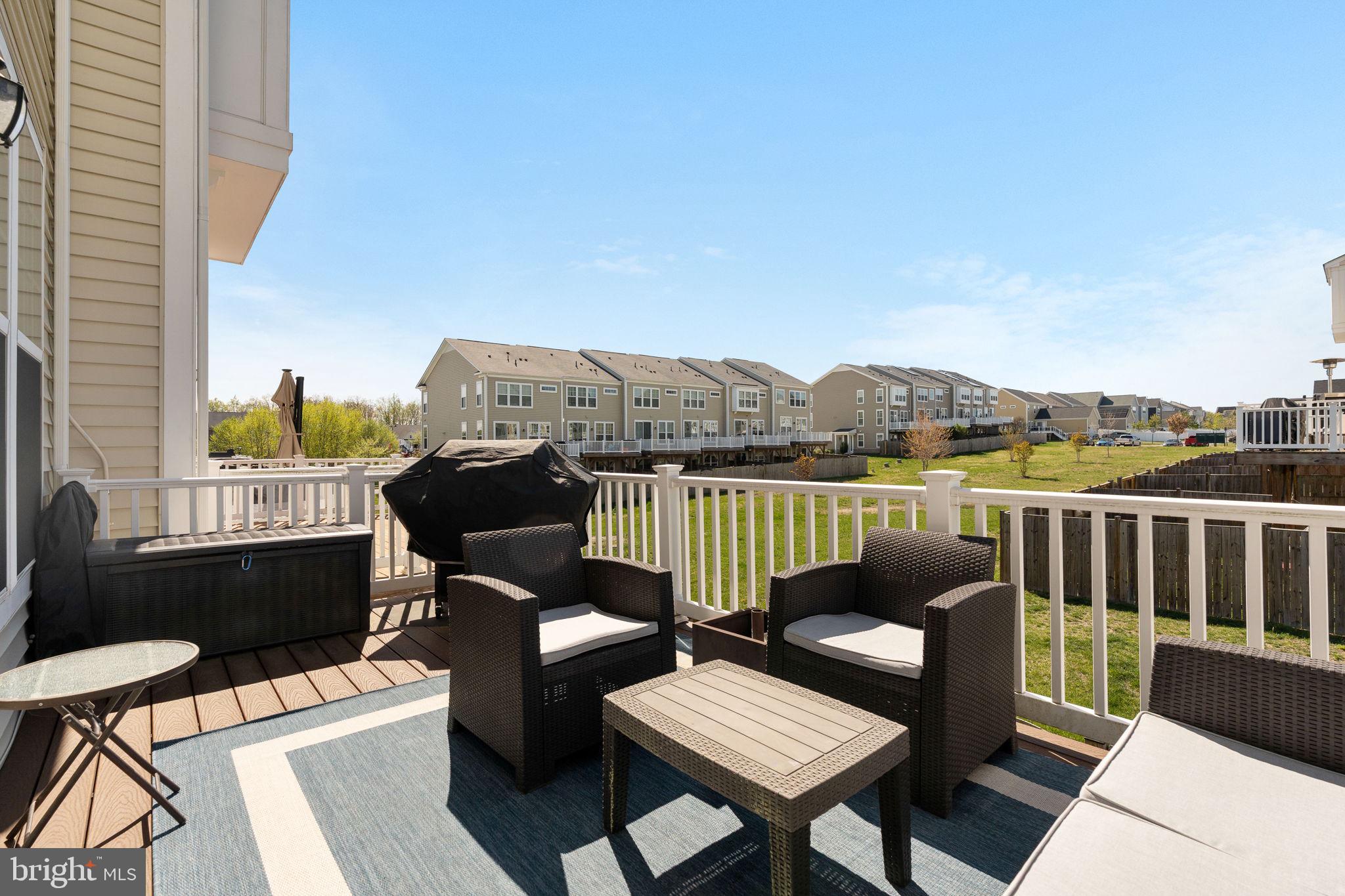 650 Aspen Road, Unit 108 Stafford, VA 22554 - Photo 19 of 30 a view of a balcony with two chairs and a table