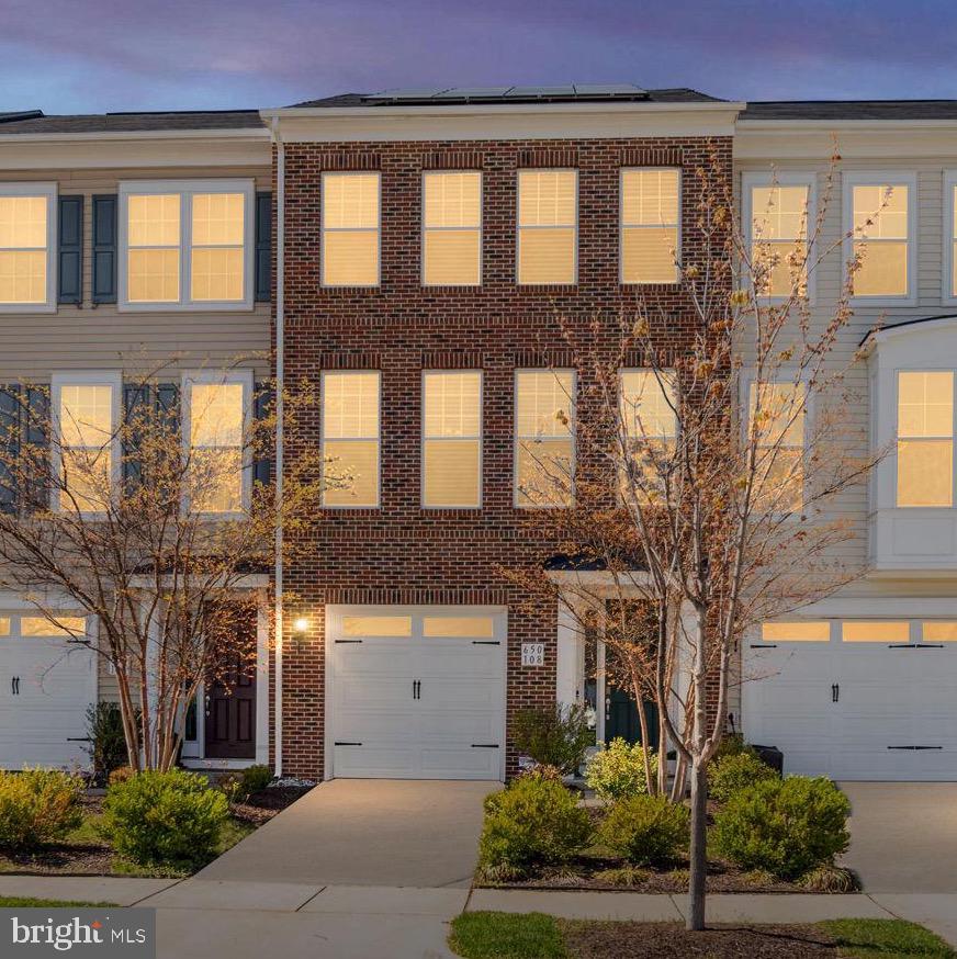 650 Aspen Road, Unit 108 Stafford, VA 22554 - Photo 2 of 30 a front view of a building with a garden