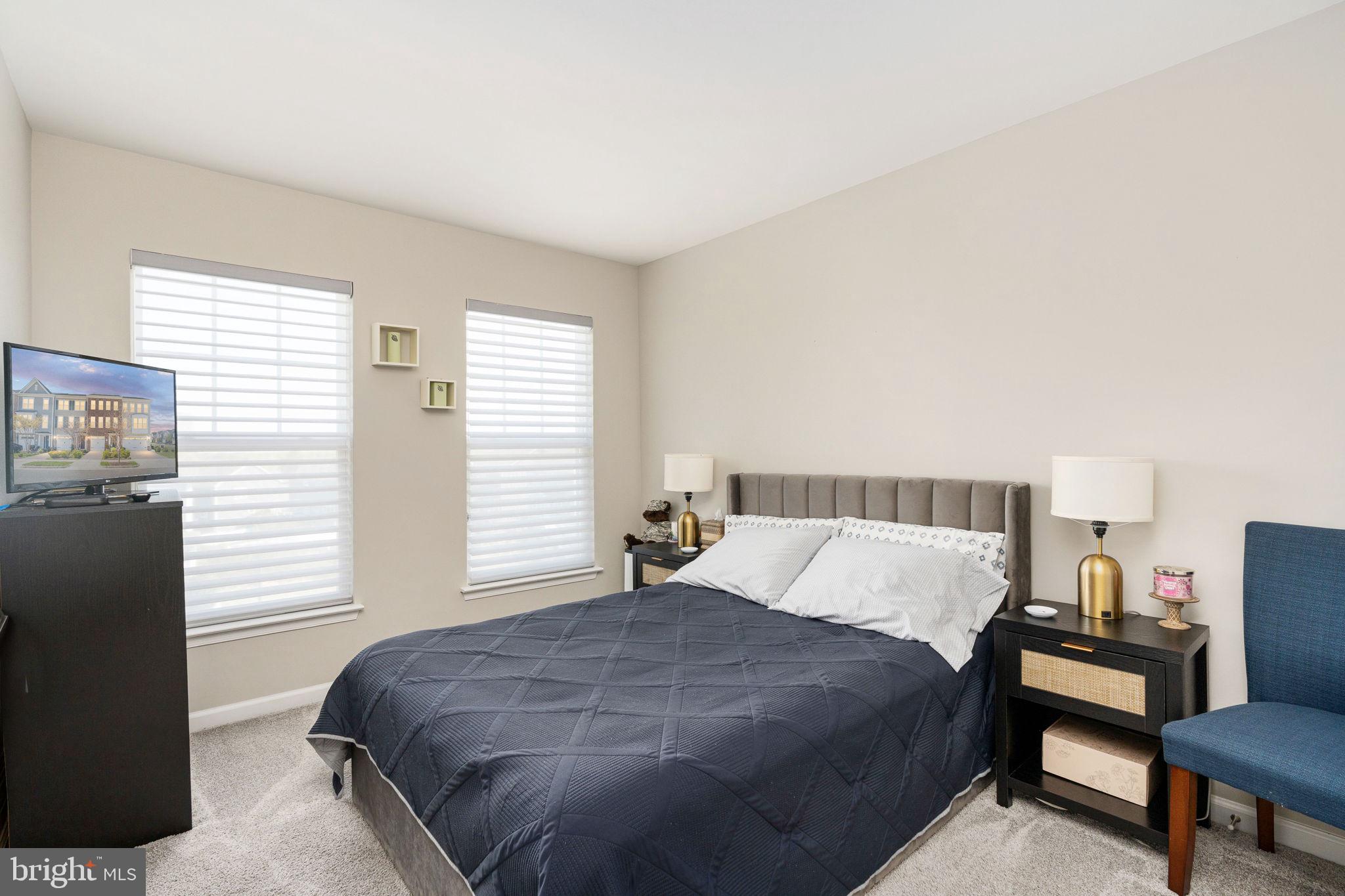 650 Aspen Road, Unit 108 Stafford, VA 22554 - Photo 24 of 30 a bedroom with a bed and a window