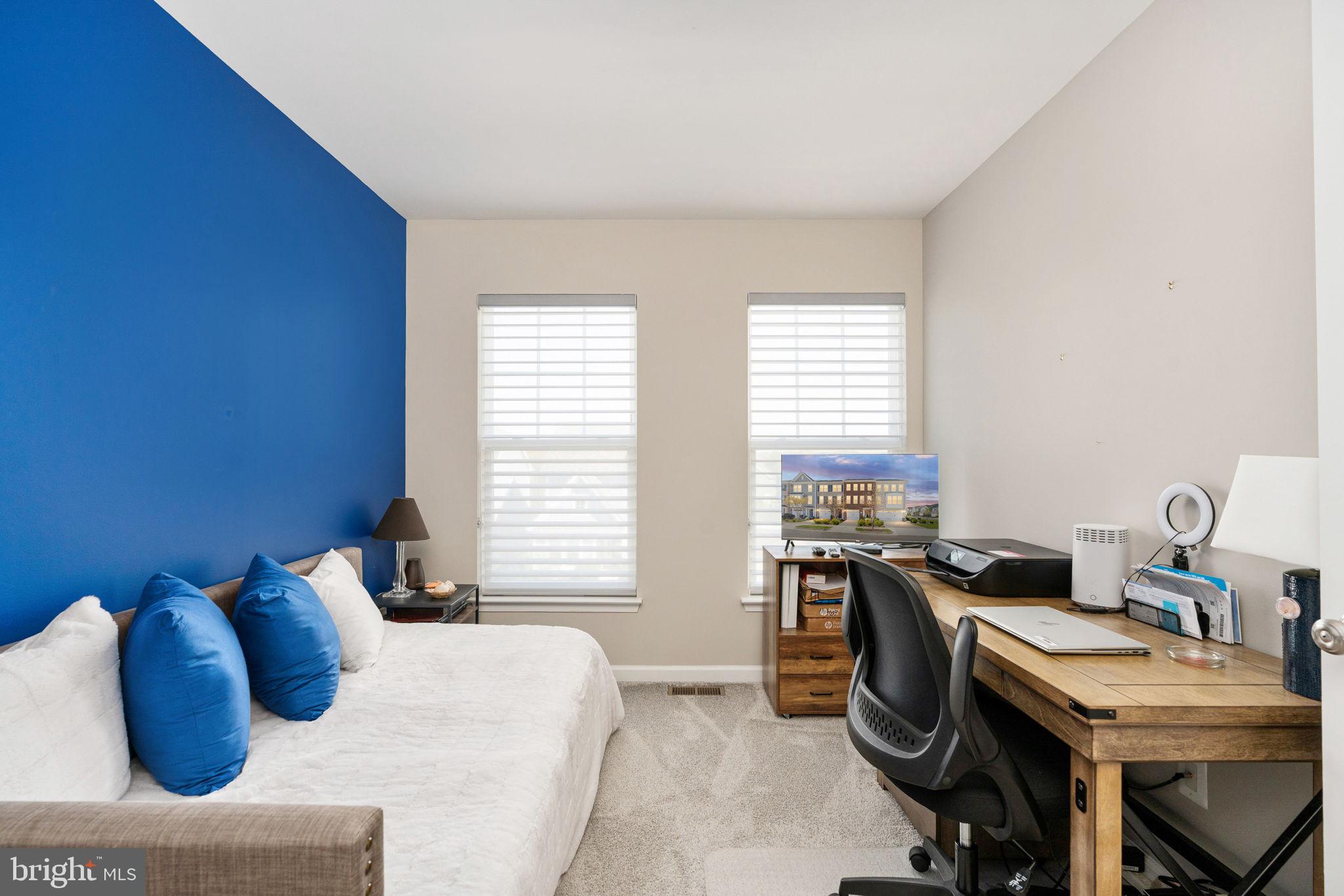 650 Aspen Road, Unit 108 Stafford, VA 22554 - Photo 25 of 30 a bedroom with furniture and a window