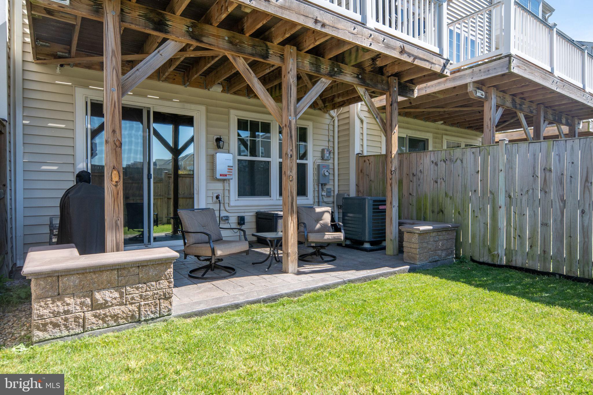650 Aspen Road, Unit 108 Stafford, VA 22554 - Photo 27 of 30 a view of a chair and table in backyard of the house