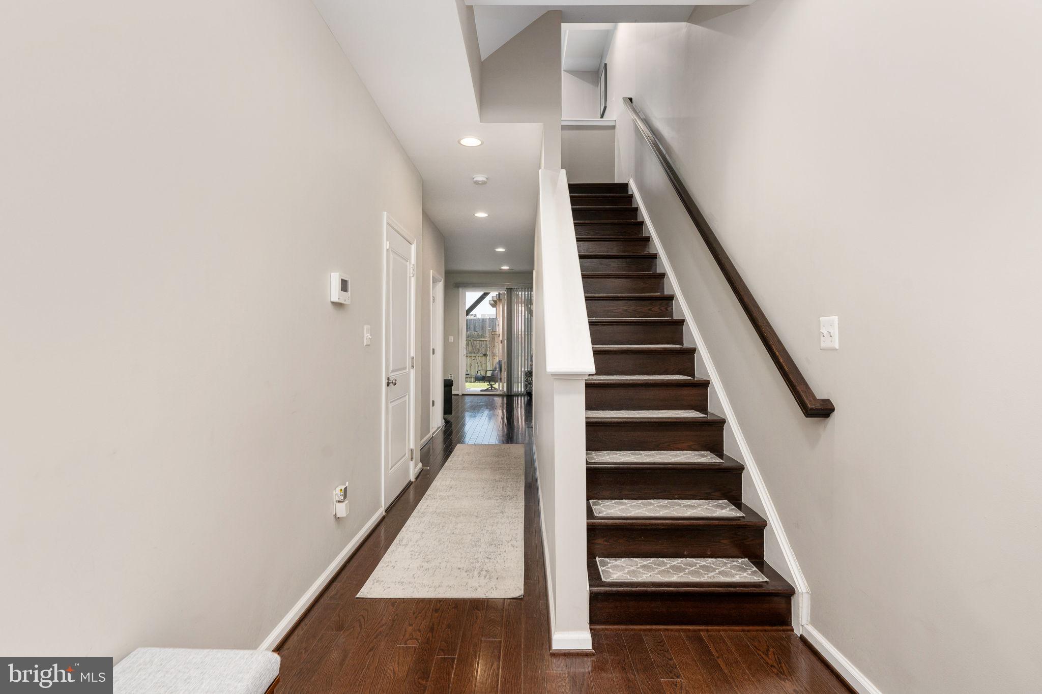 650 Aspen Road, Unit 108 Stafford, VA 22554 - Photo 6 of 30 a view of entryway and hall with wooden floor