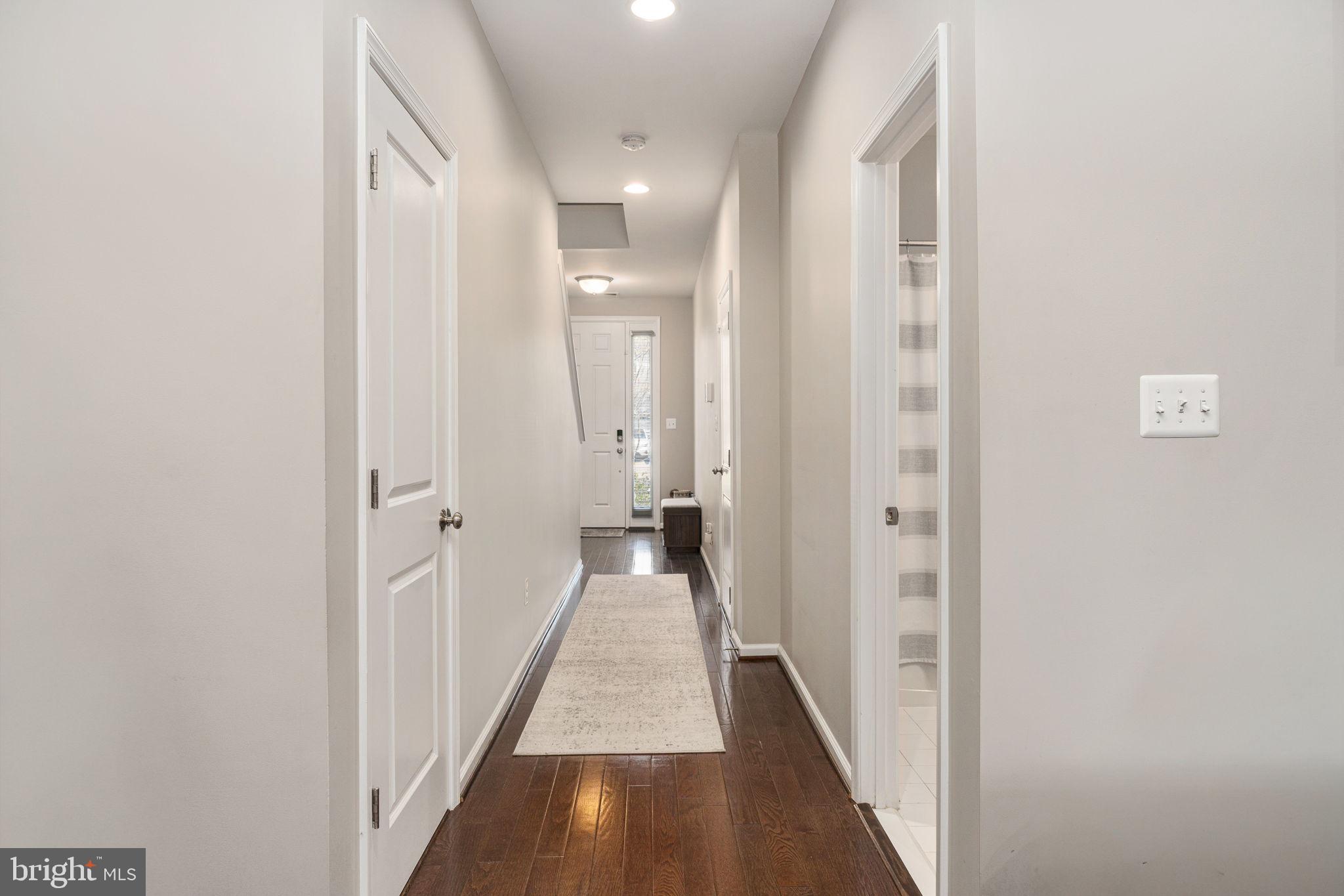 650 Aspen Road, Unit 108 Stafford, VA 22554 - Photo 7 of 30 a view of a hallway with a wooden floor