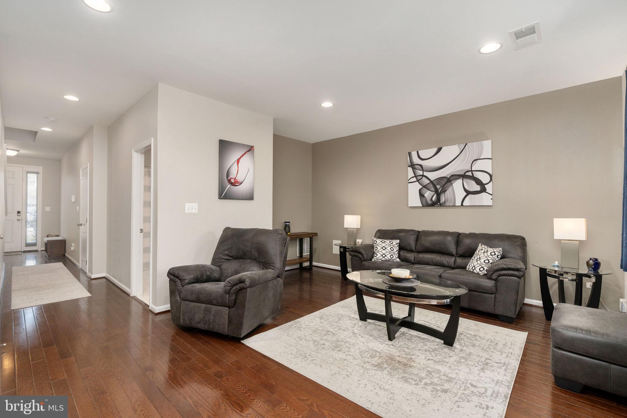 650 Aspen Road, Unit 108 Stafford, VA 22554 - Photo 9 of 30 a living room with furniture and a couch