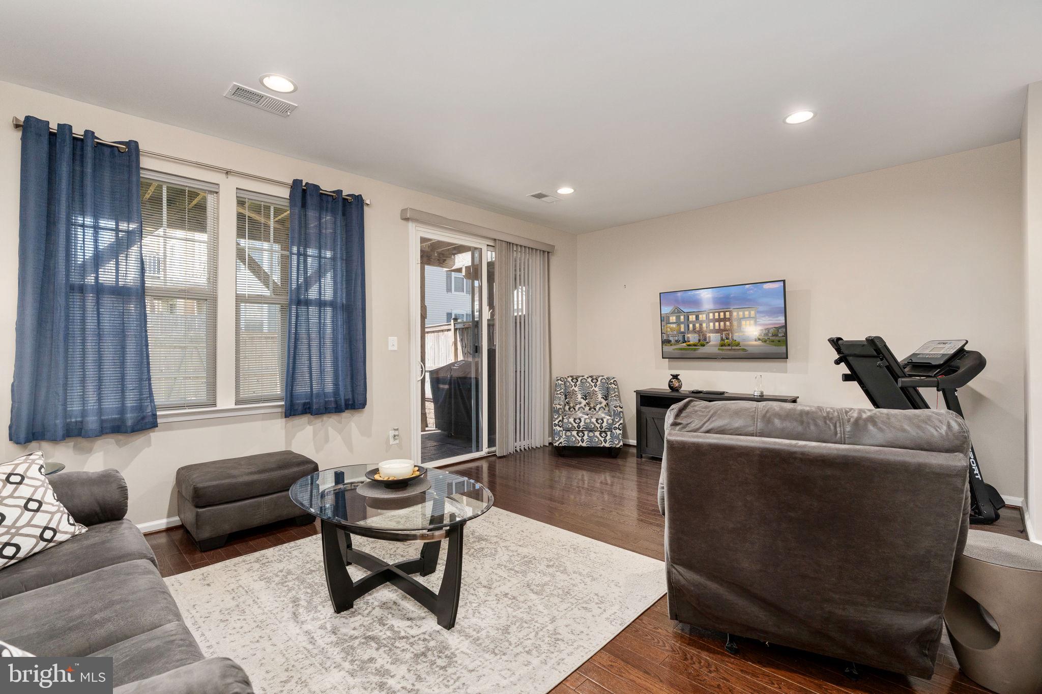 650 Aspen Road, Unit 108 Stafford, VA 22554 - Photo 10 of 30 a living room with furniture and a flat screen tv