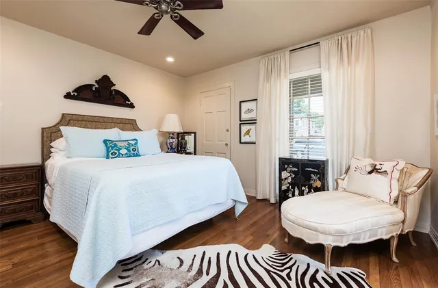 a bed room with a bed and a chandelier