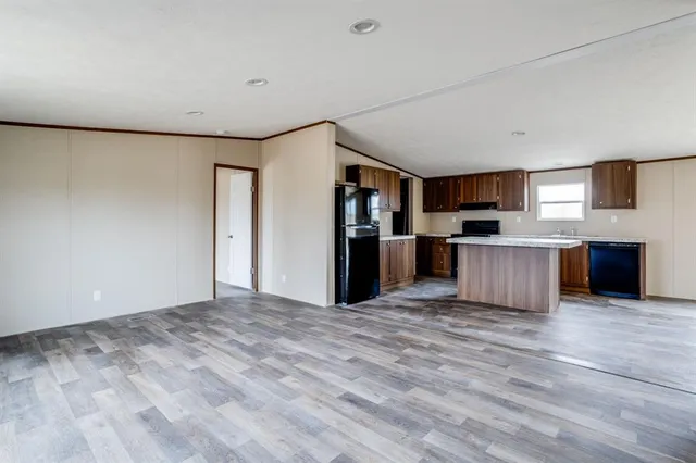 a view of a kitchen cabinets a sink and wooden floor