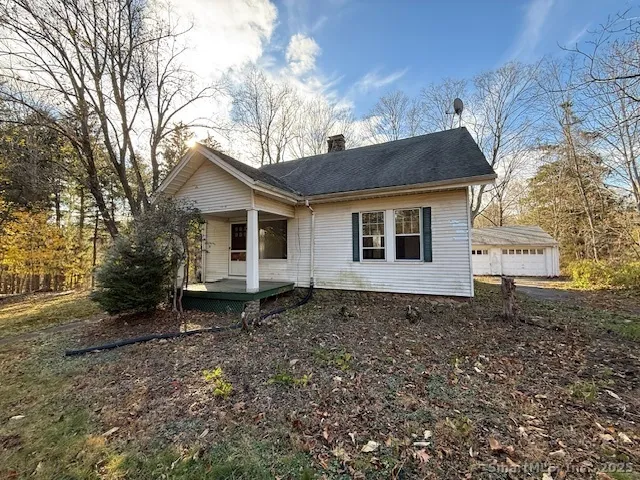 a house with trees in the background