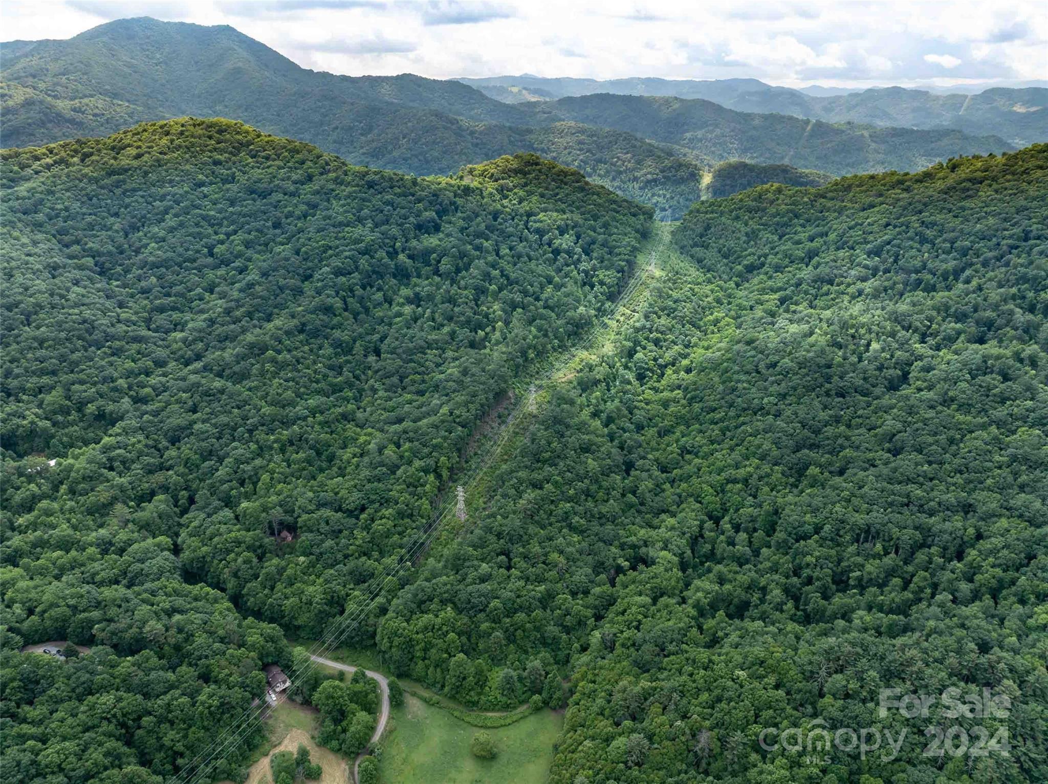 0 Water Wheel Cove Clyde, NC 28721 - Photo 20 of 22 a view of a mountain range with lush green forest